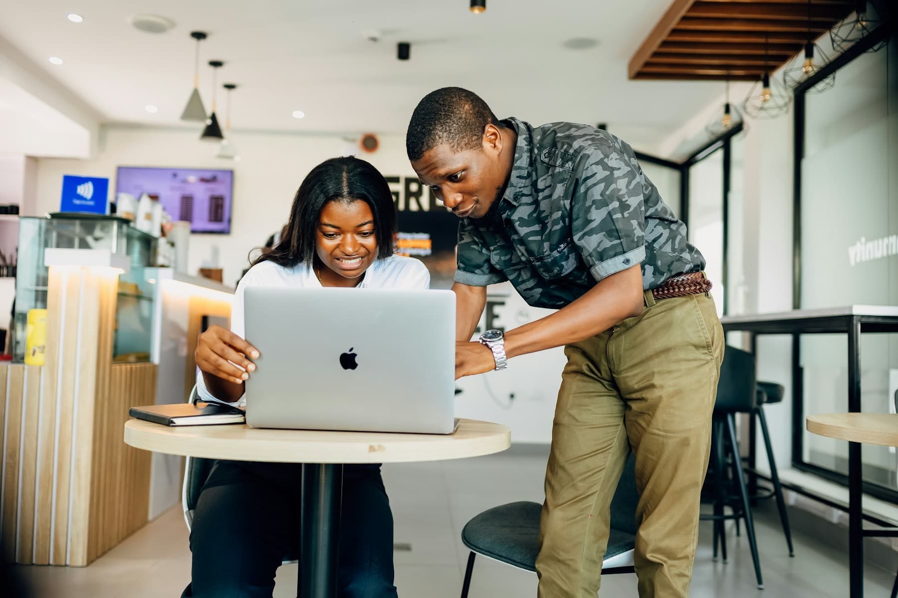 An advisor helping a client on her laptop