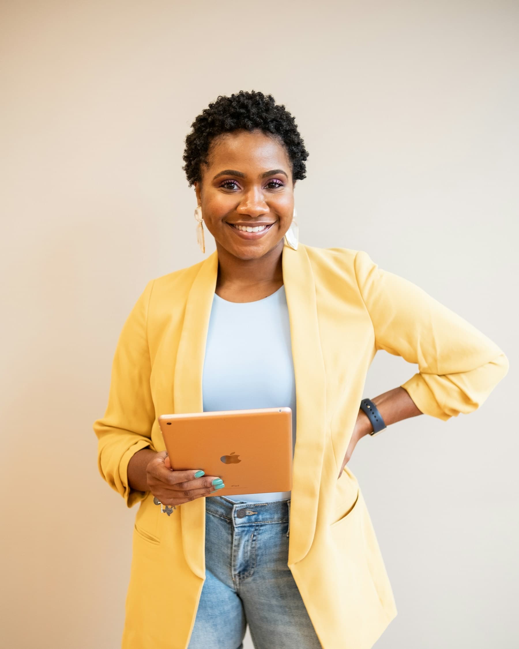 Smiling entrepreneur holding a tablet